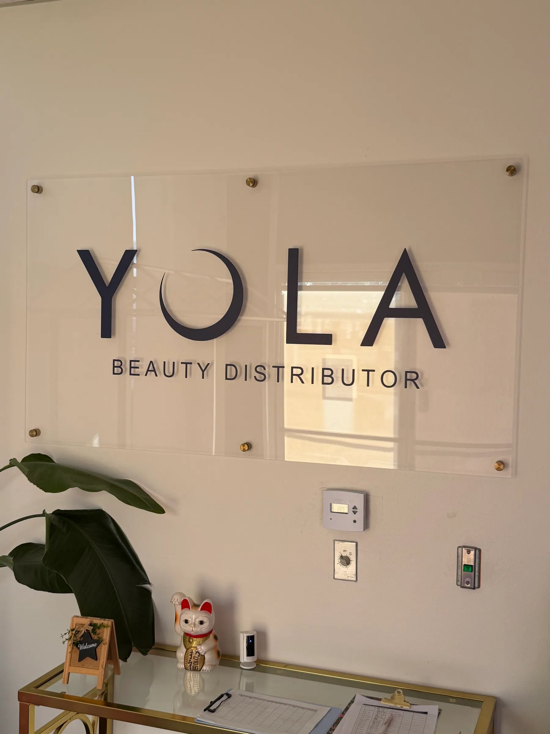 Yola Beauty Distributor sign in the reception area