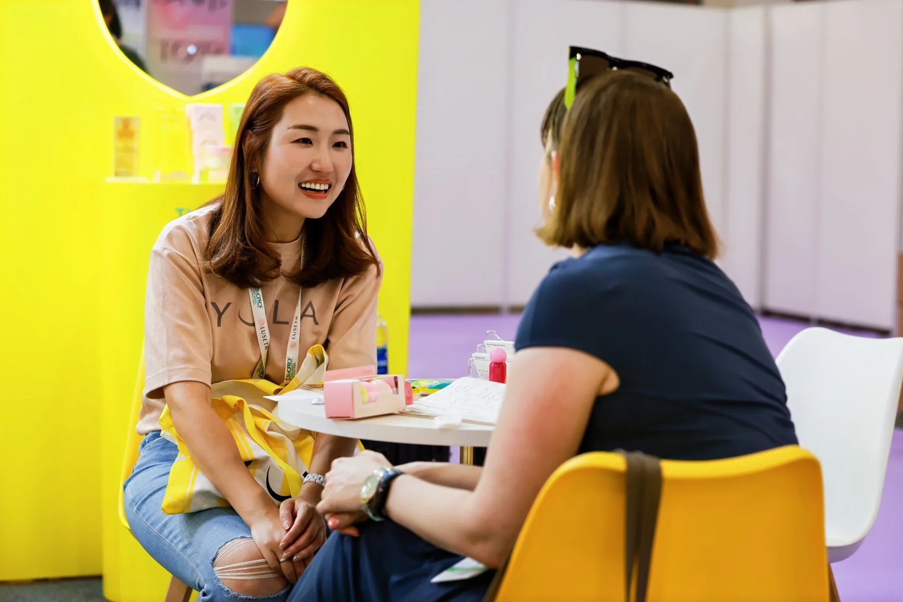 Meeting face to face at the Yola booth, with space to sit down and exchange ideas.