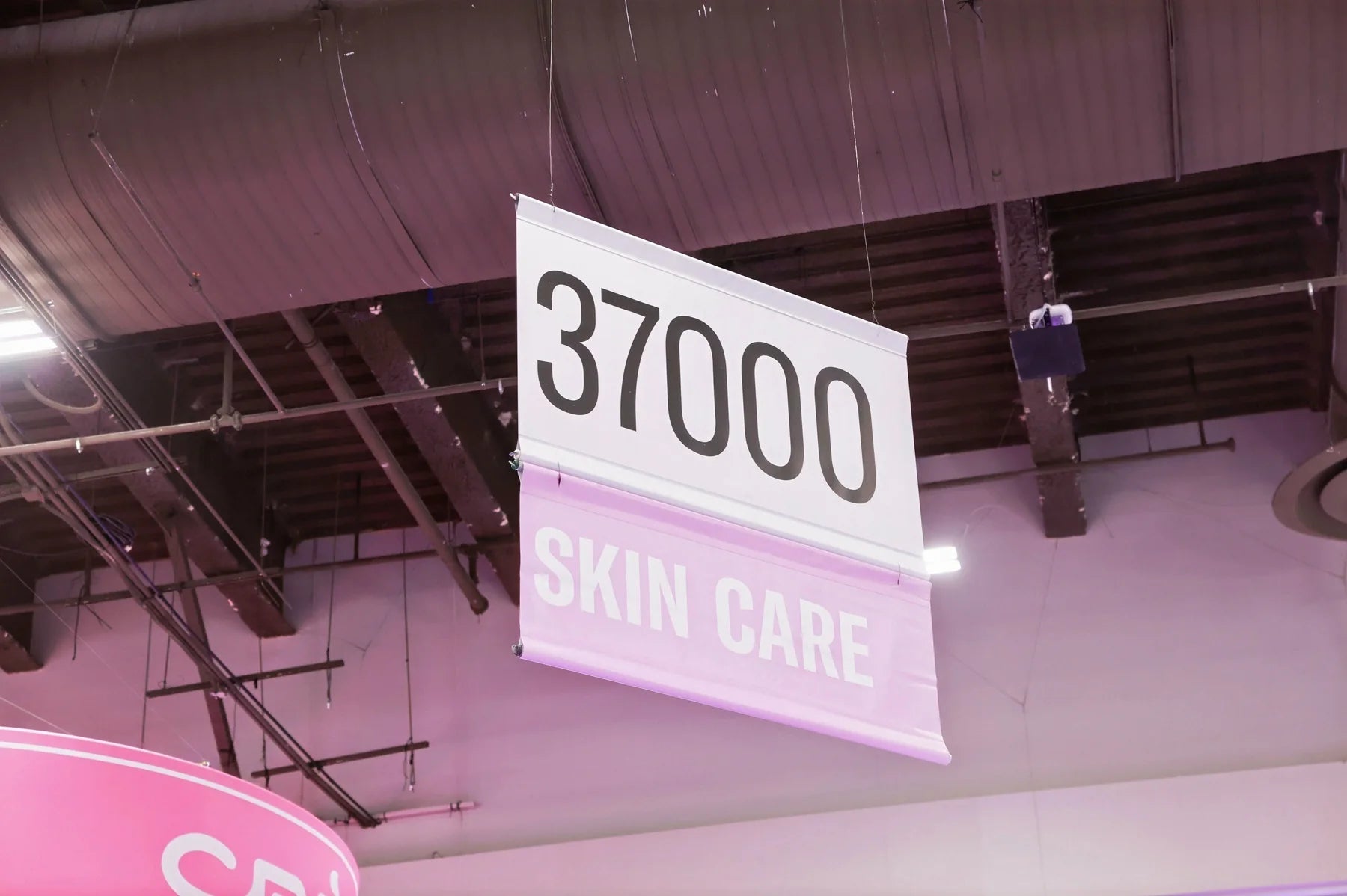 The skincare aisle sign offers a glimpse of the scale and organization of the exhibition.