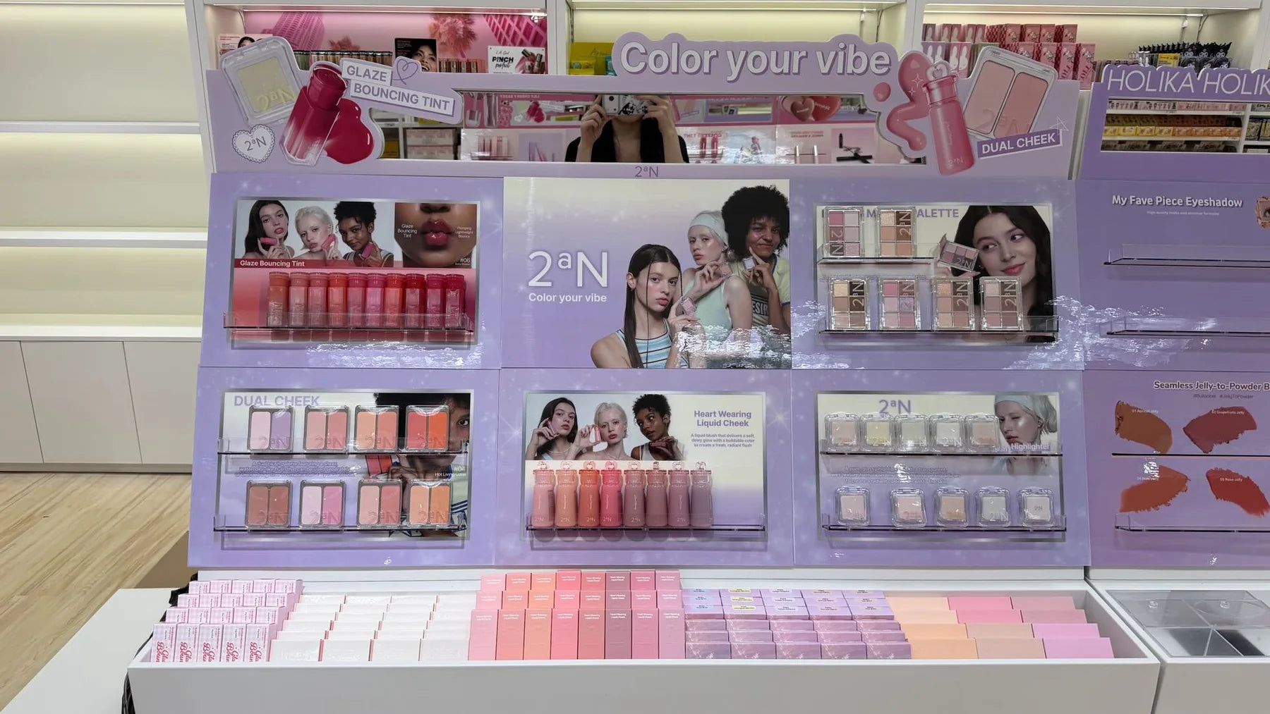 Color and brand imagery help define the 2aN section, with products arranged for side-by-side discovery.