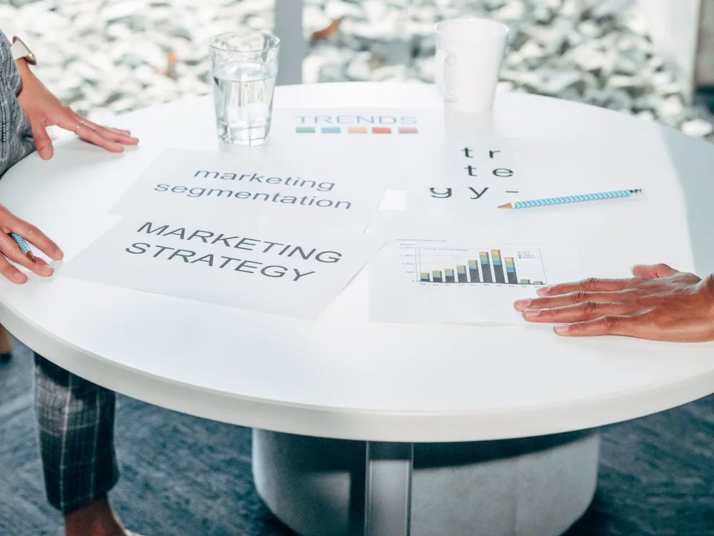 Marketing strategy and audience segmentation documents on a planning table